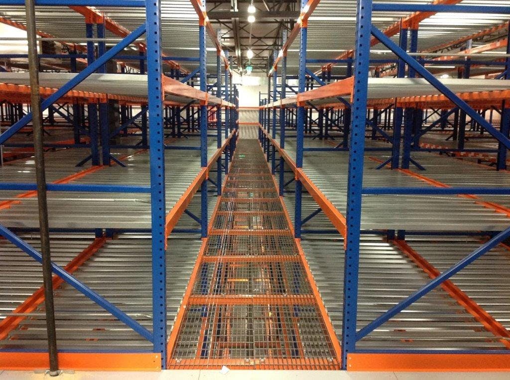 blue and orange custom designed SpaceRak system in distribution warehouse card